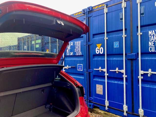unloading items into a 20 foot hi-cube container unit