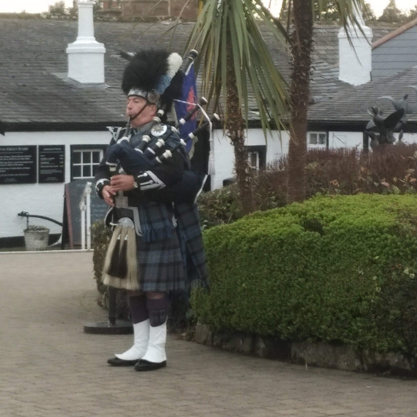 a person playing the bagpipes in south west scotland