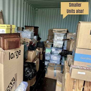 A storage container filled with boxes and items of various sizes.