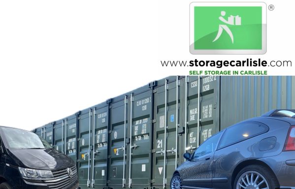 Container storage facility with parked vehicles and a logo for Storage Carlisle.