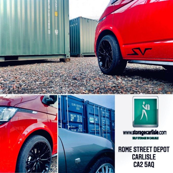 Red van with black wheels parked near shipping containers on a self storage facility.