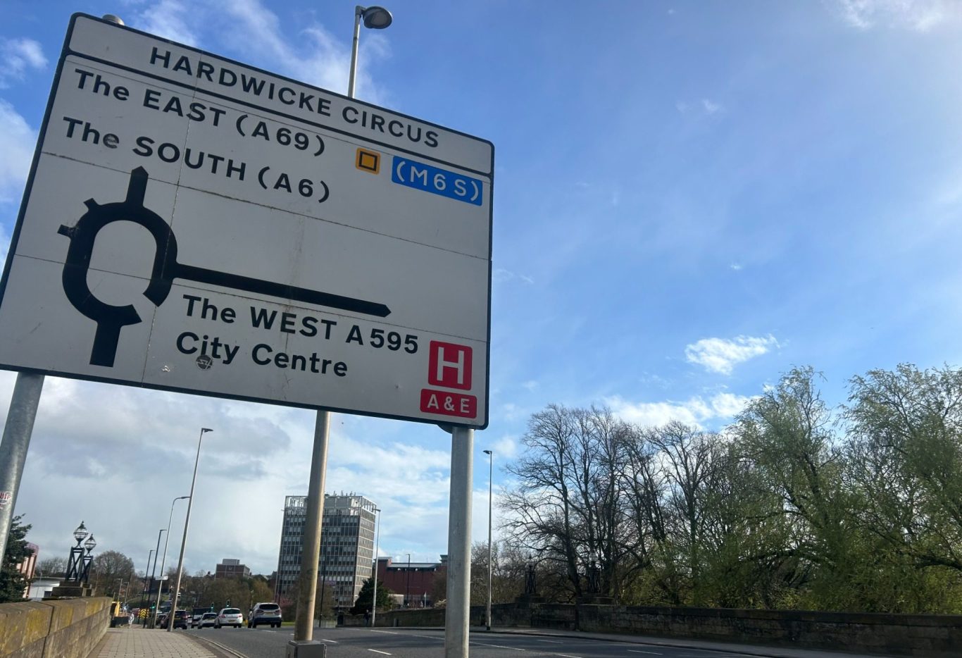 Carlisle Road sign indicating directions to the East, South, and City Centre.